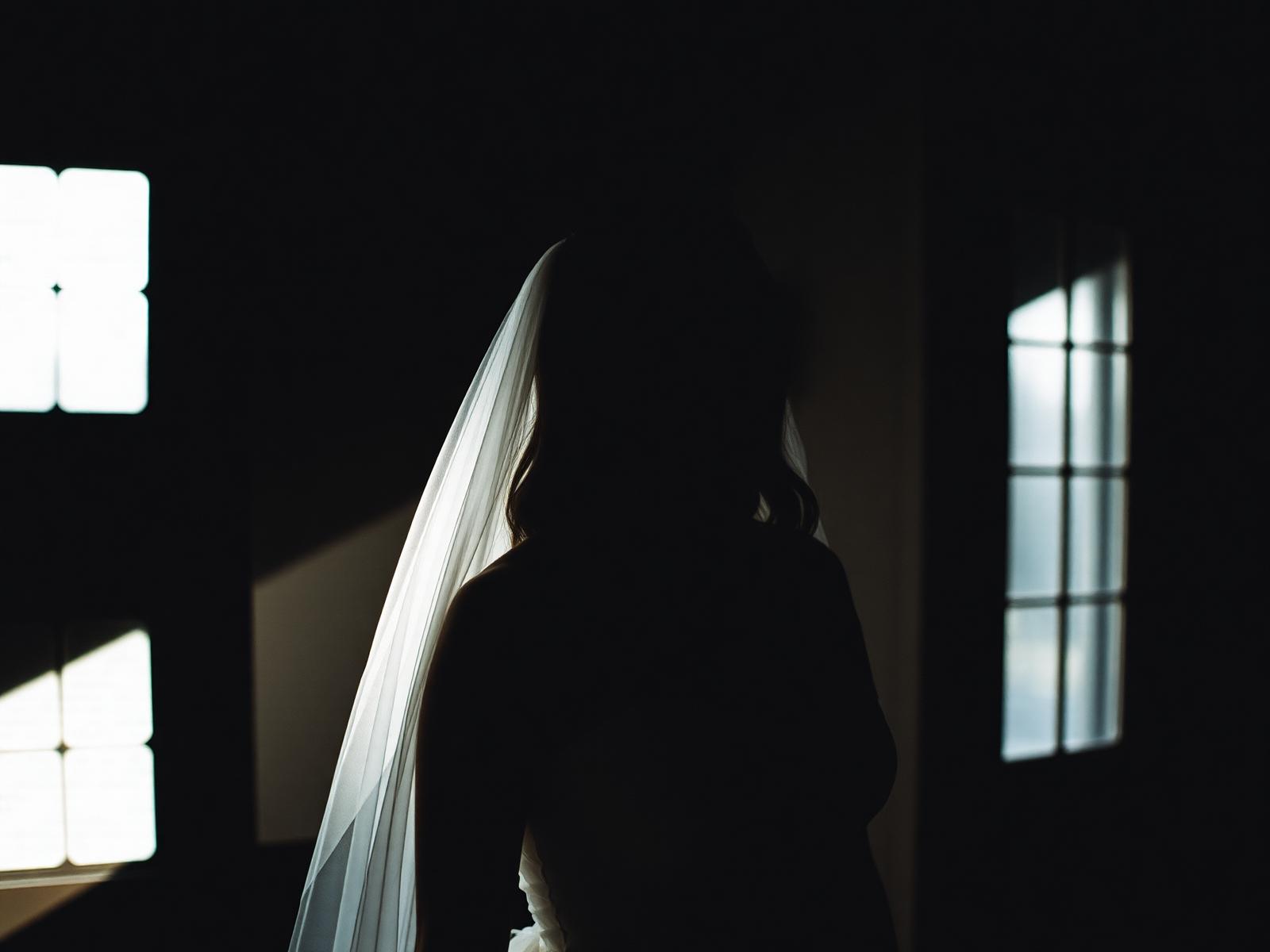 Bride silhouette in window light